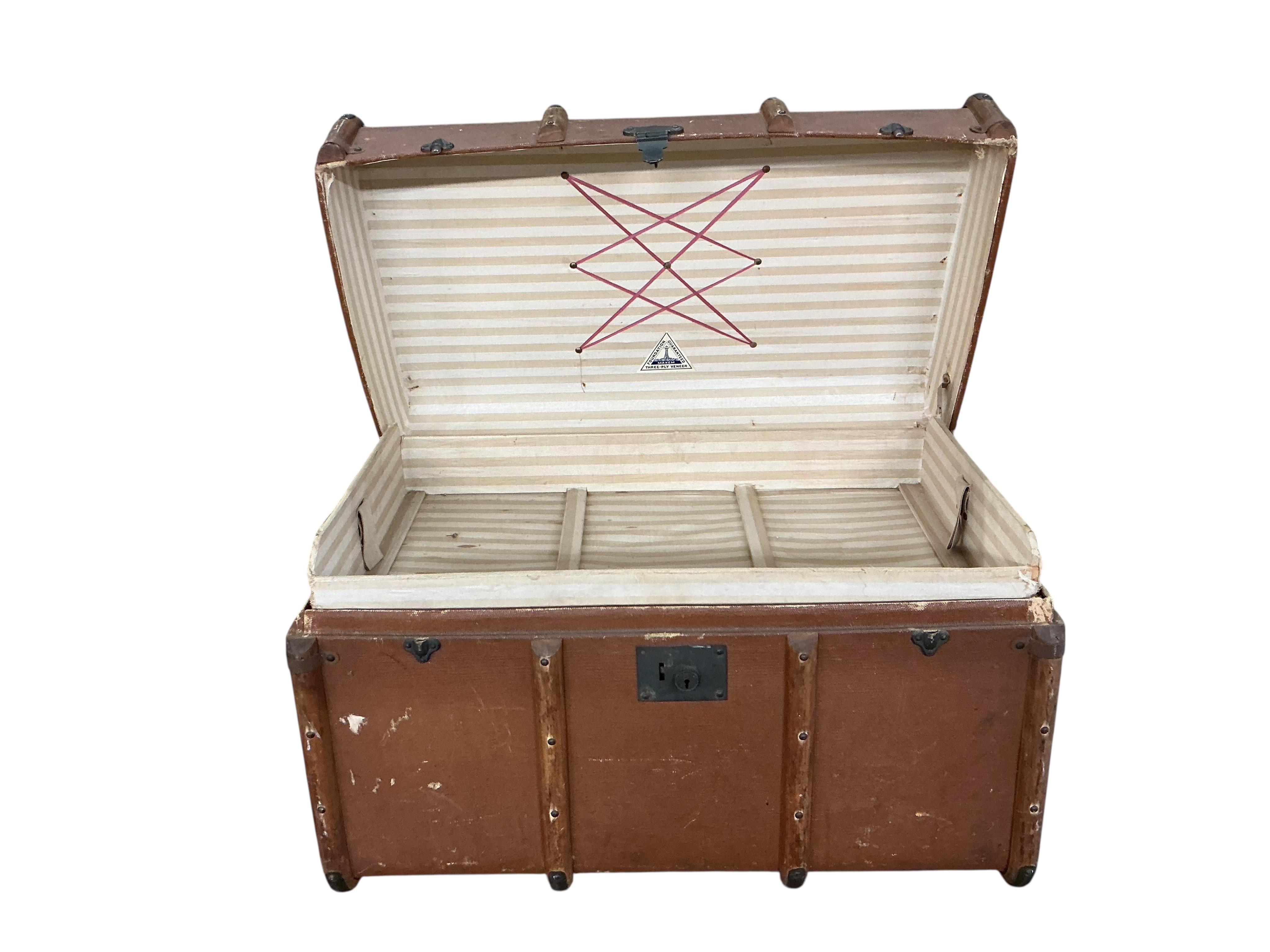 A Victorian painted tin trunk, width 60cm, depth 40cm, height 36cm together with a later larger canvas covered trunk